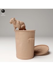 Raccoon coming out of garbage