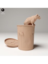 Raccoon coming out of garbage